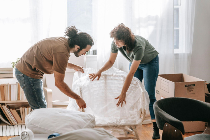 A couple fixing furniture